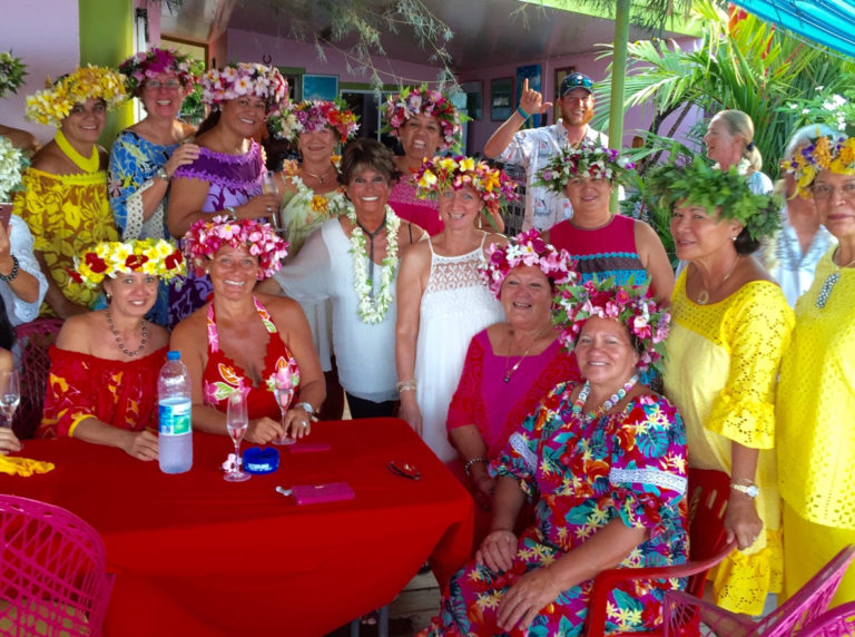 Francesca and other guests celebrate the birthday of our friend Frendoo (not featured). In the background, Double X crew member Paul happily shares a friendly “hang loose” sign. Raiatea, October 2016.