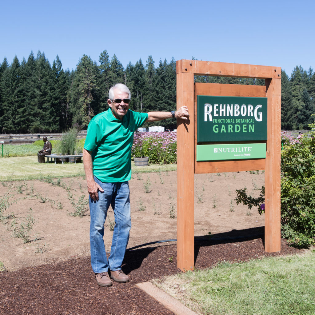 Standing next to the Rehnborg Functional Botanical Garden sign during Amway North America Farm Day. I’m ready to get to work! Trout Lake Farm, Wash., July 2017. Photo: Darwin Hintz