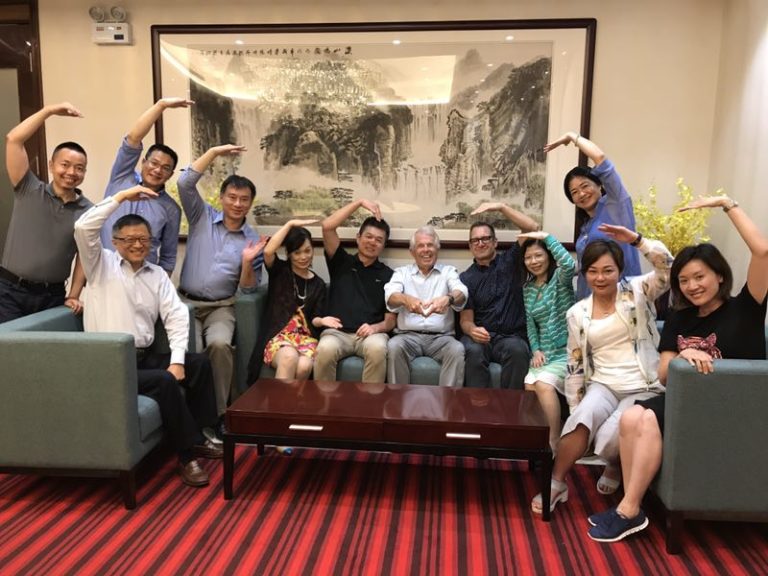 Amway China team members join in to pose for a group hand-heart at our farewell dinner in Guangzhou. This is a perfect gesture for this friendly group filled with so many smiles and much passion and personality. Guangzhou, China. July 2017.