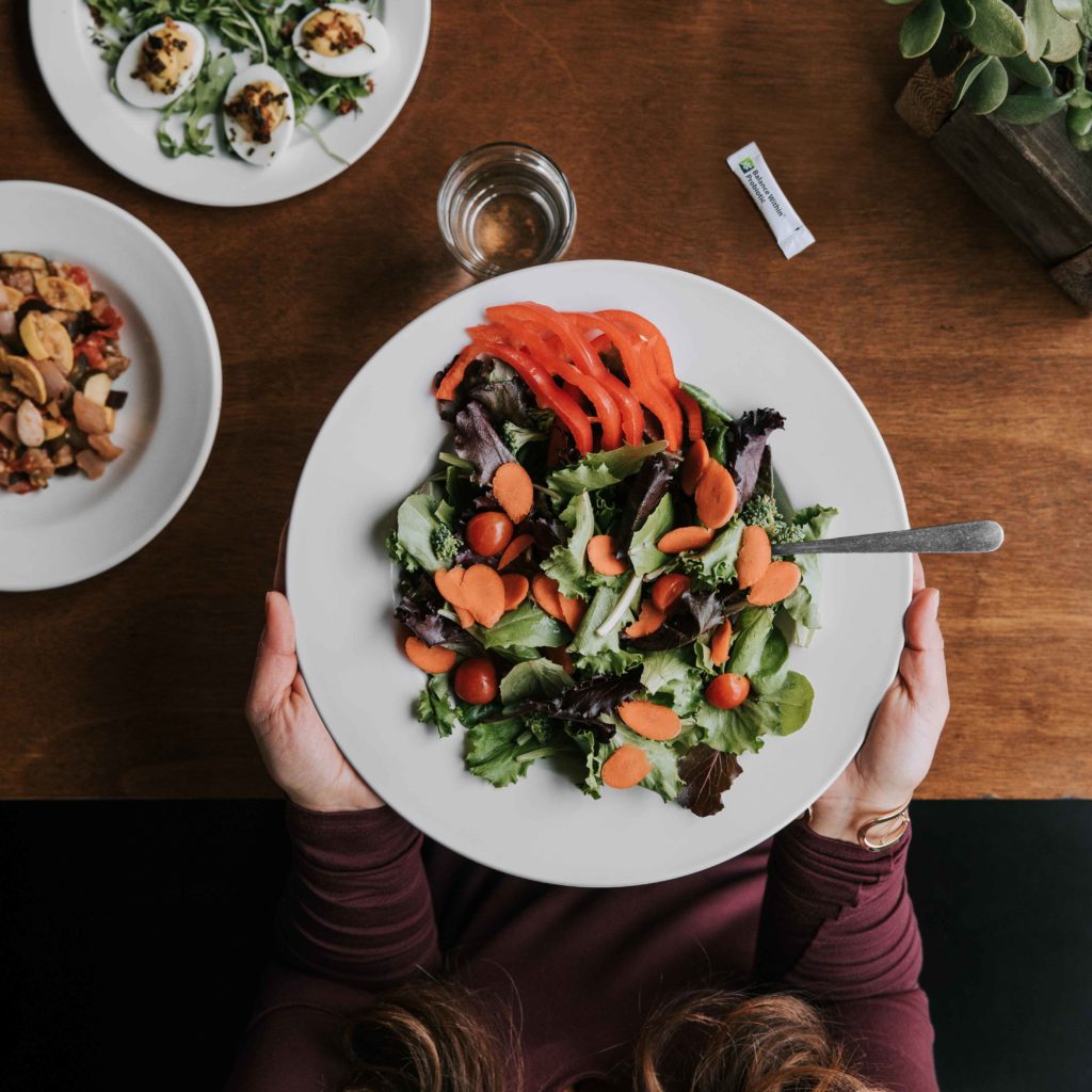 A colorful meal brimming with vegetables. A diet rich in plant-foods helps nourish your healthy gut bacteria.