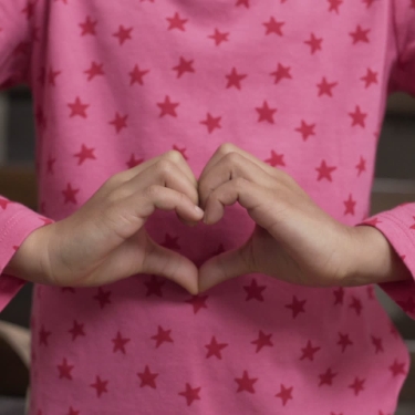 Woman making a heart hand symbol over her stomach. Three lifestyle factors — no smoking, less stress, and regular exercise — are things you can do right now to improve the health of your gut microbiome. Love your gut, and your gut will love you right back!