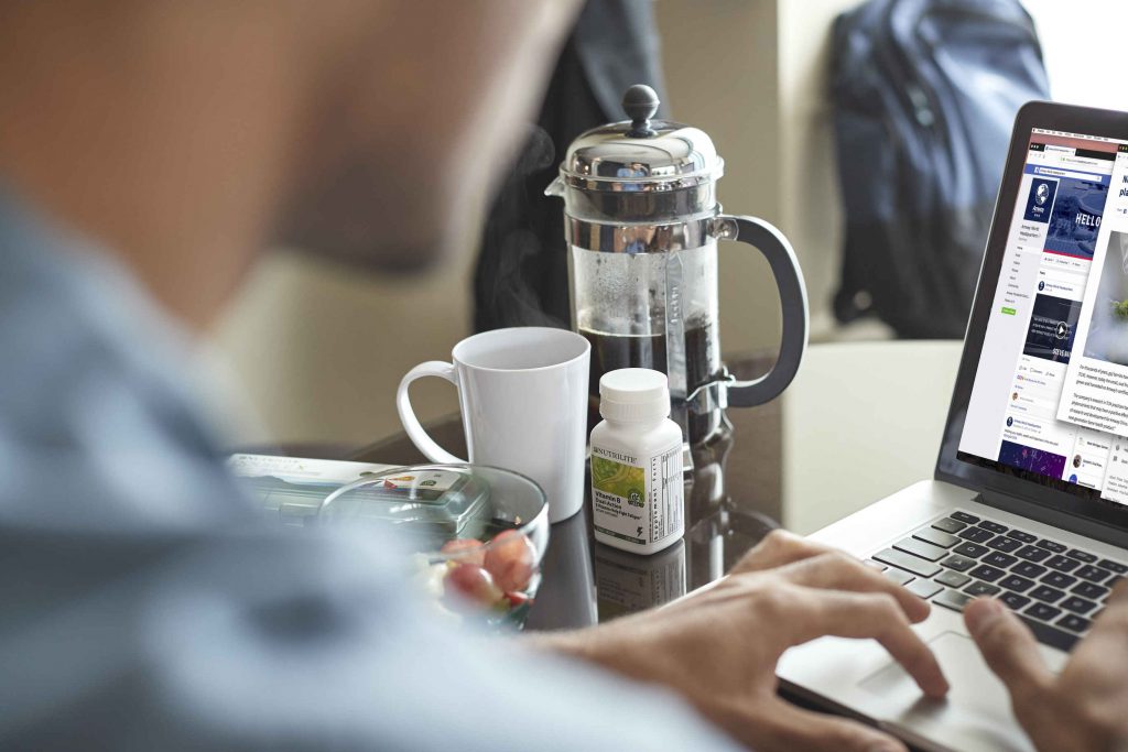 Young man at work on a laptop. My six-step plan for sharing Nutrilite® products is one of the most important predictors of business success, especially in today’s digital world. 