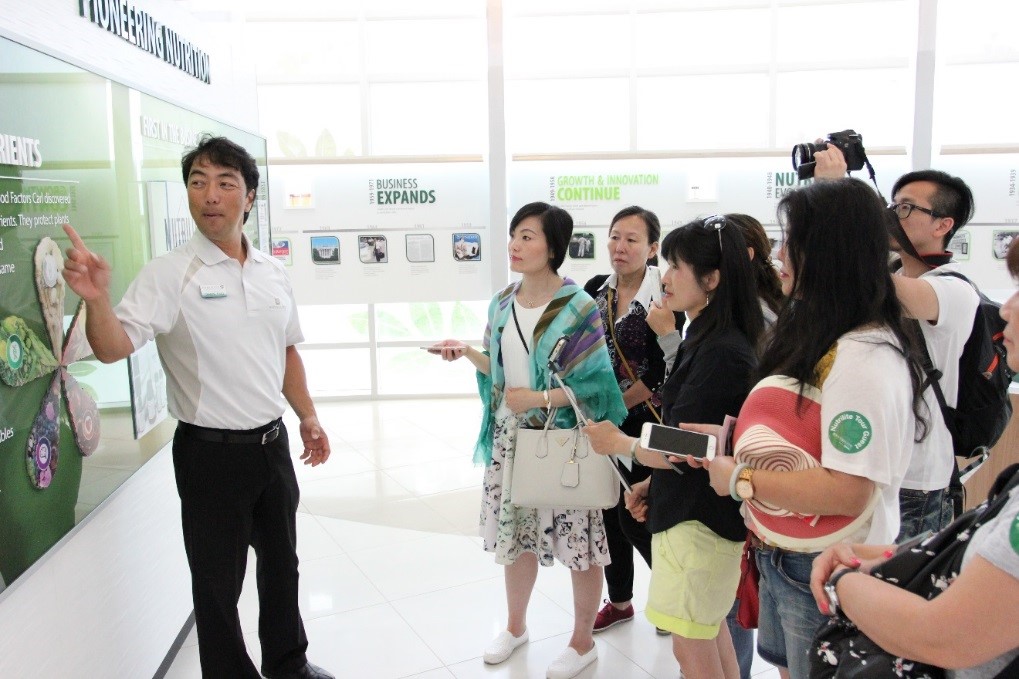 Tour guide Takeshi Saito explains the importance of colorful plant foods and their phytonutrients to a group of guests visiting Nutrilite’s Center of Optimal Health, Buena Park, Calif.