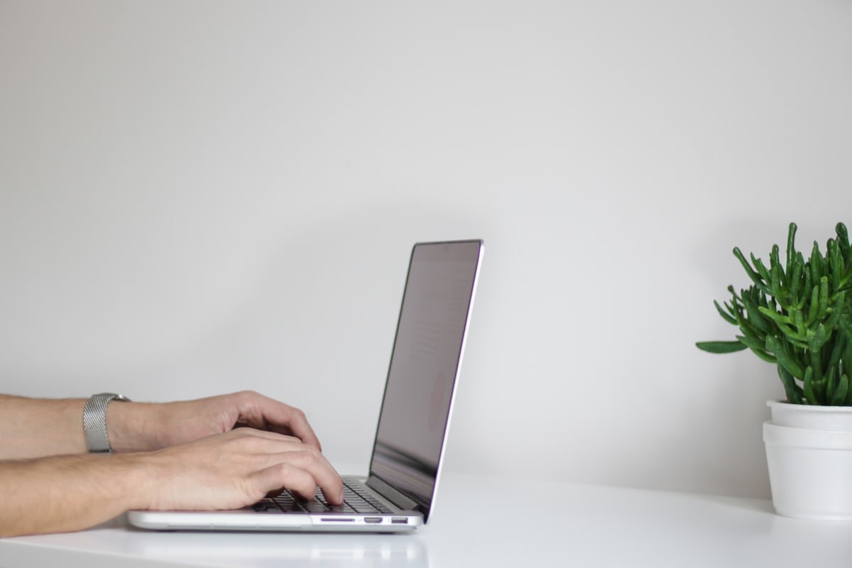 Hands type on a laptop. More hours in front of a digital screen means it is more important than ever to do all we can to protect our vision.