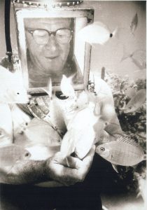 My father was always young at heart. The fish seemed to be as interested in him as he is in them!