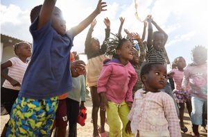 Children jumping and having fun. Healthy children are happy children primed to reach their full potential.