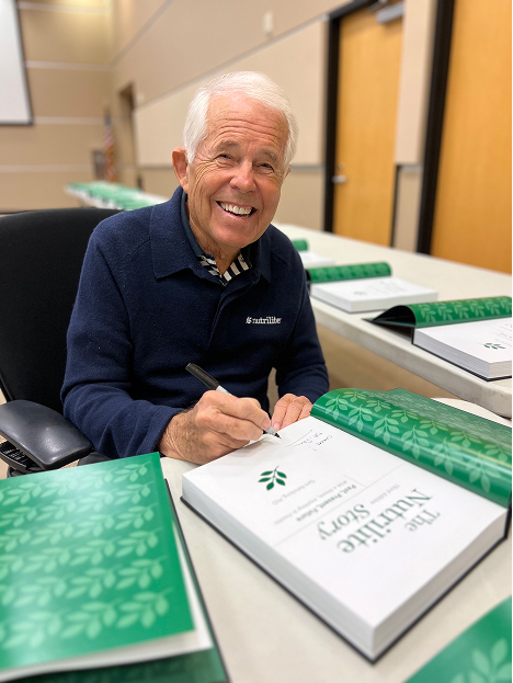 Dr. Sam signing copies of his book The Nutrilite Story